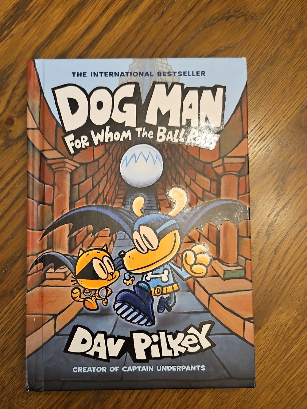 Scholastic Dog Man: For Whom the Ball Rolls Graphic Hardcover Book